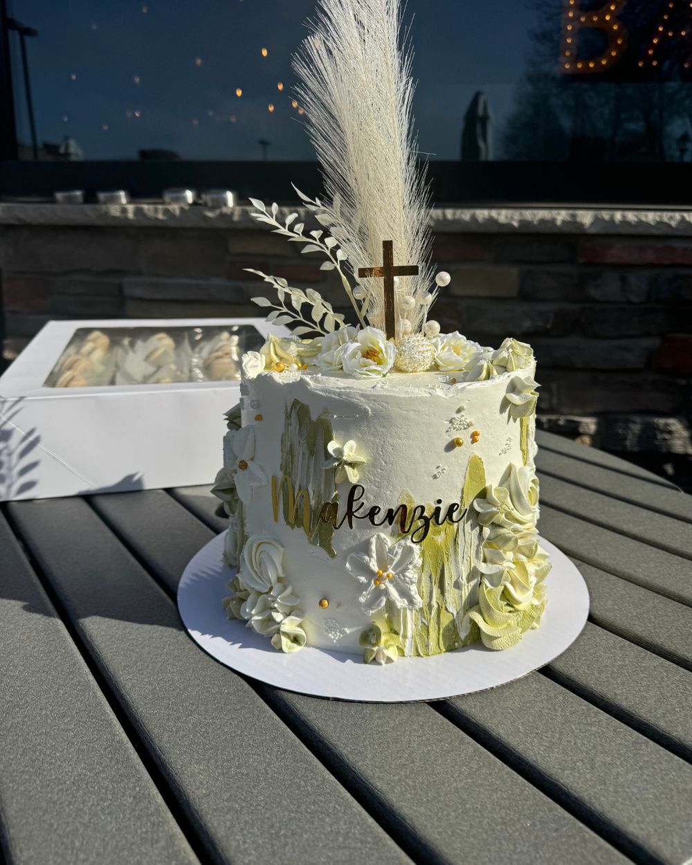 Cake with gold cross and pampas